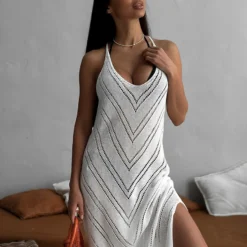 Bornladies Hanging Neck Knitted Dress Spring/Summer 2026 New Hollow Slim Skinny Holiday Style Split Long Dress